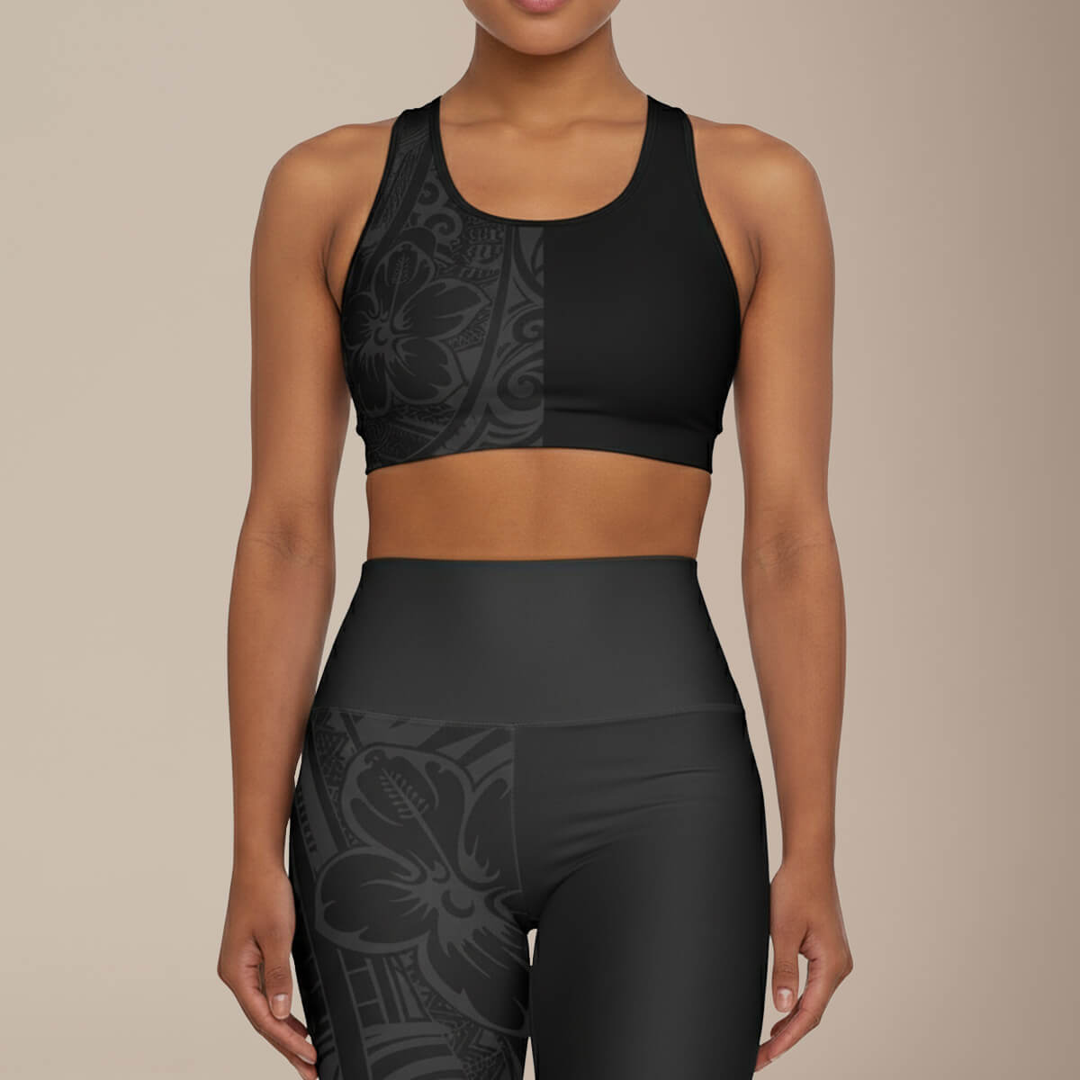 Black seamless sports bra by FYBY with dark bloom design, featuring supportive stitching, ideal for active wear.