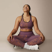 Black seamless sports bra with white stitching from Miami Sublimation, styled with high-waisted IslandRise leggings in Brandied Melon.