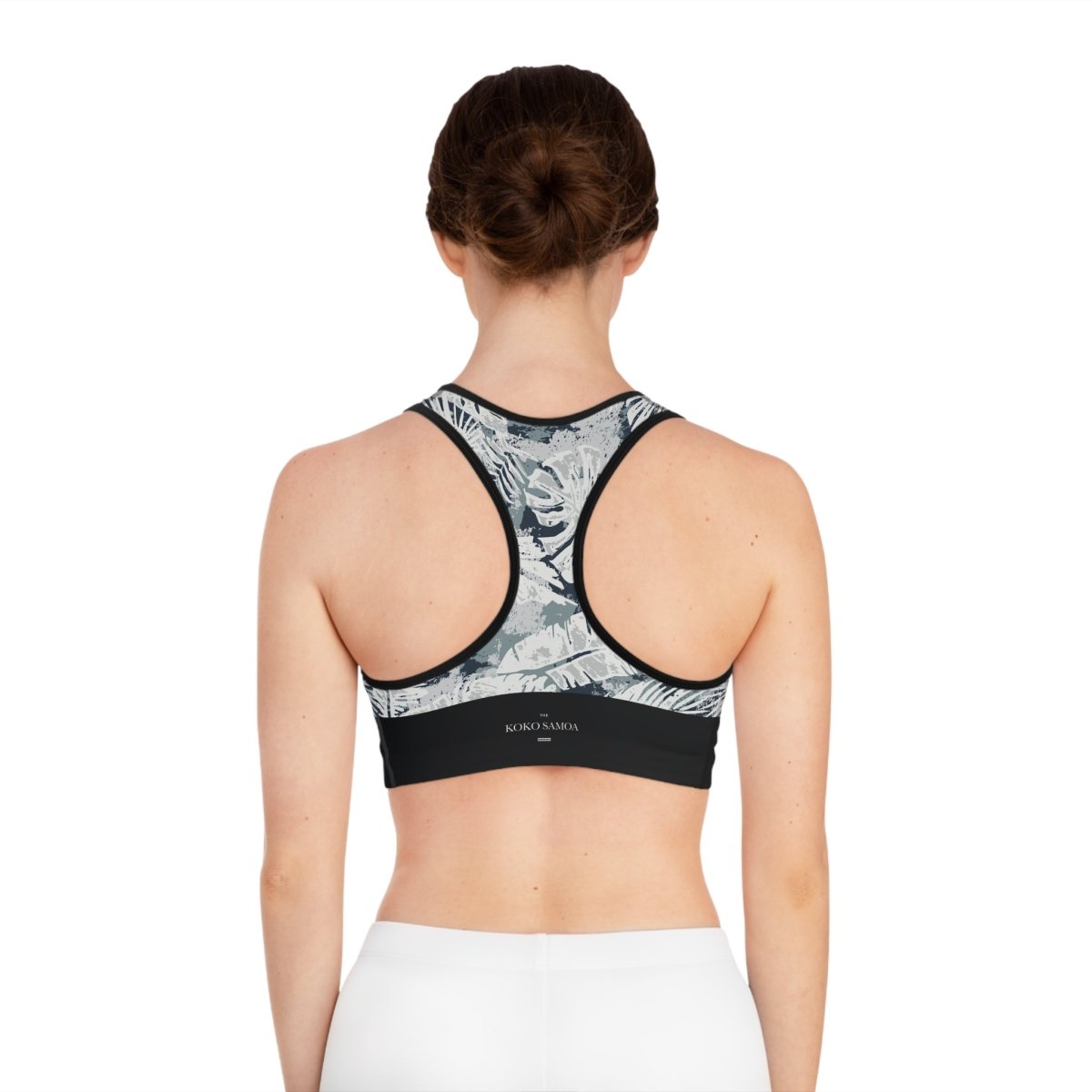 Black FYBY Seamless Sports Bra with subtle stitching and Solosolo Blooms design, ideal for active wear.