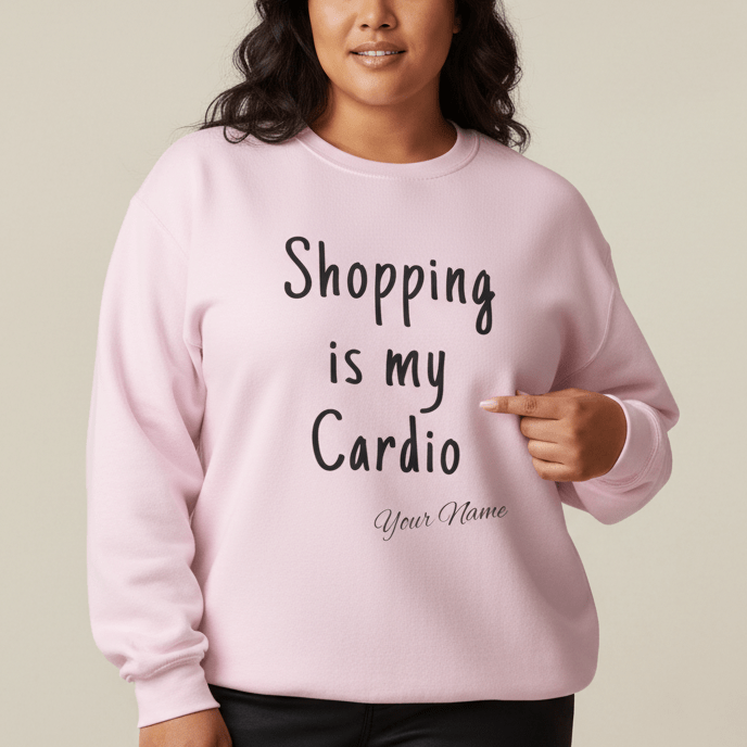 Unisex heavy sweatshirt with "Shopping is My Cardio" graphic from The Print Bar, in ash color, casual and cozy apparel.