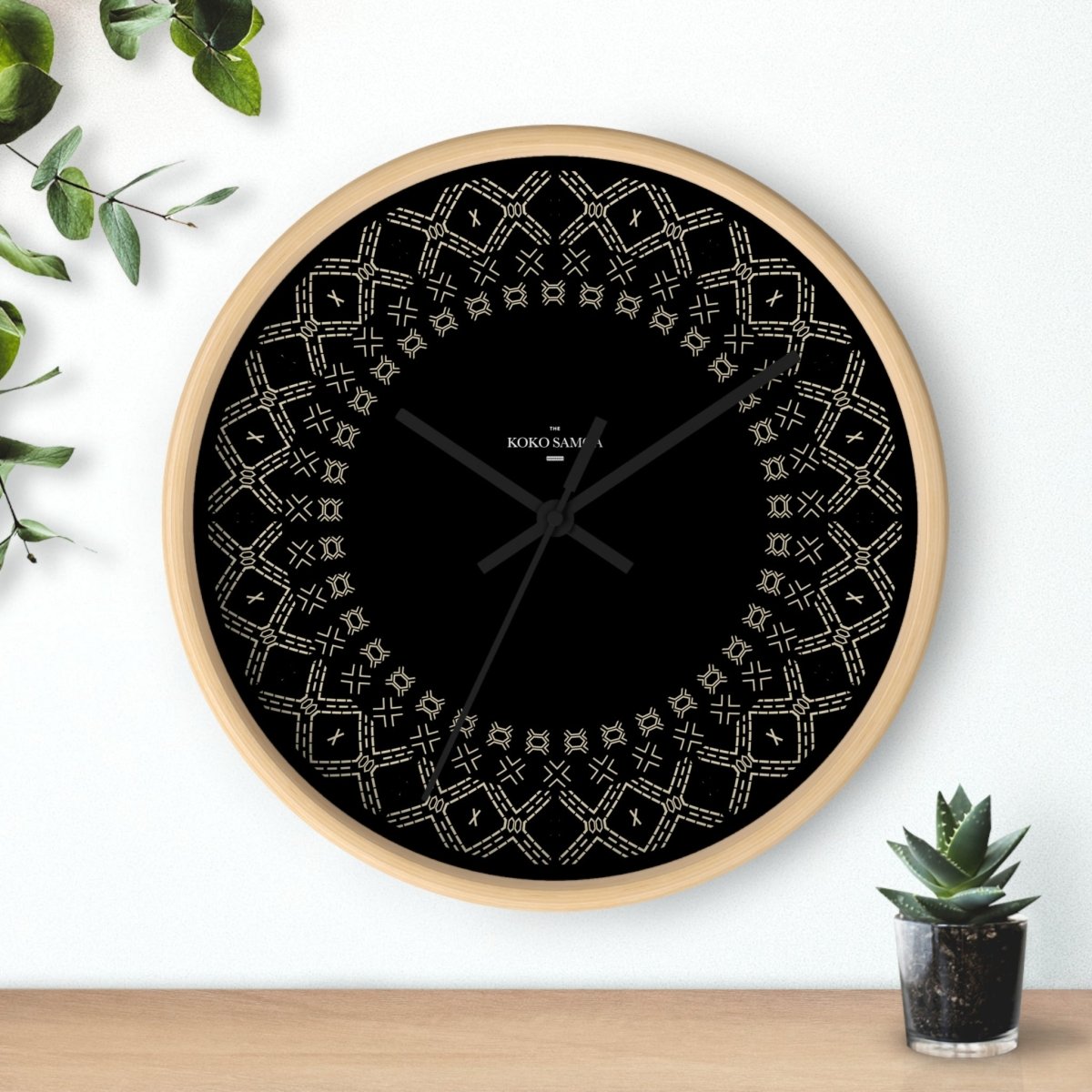 Spoke Malu 10-inch black and white wall clock with modern design, suitable for AU, NZ, and US settings.