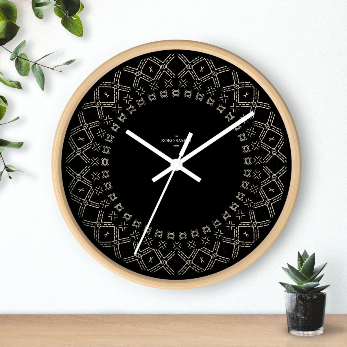 Spoke Malu 10-inch wall clock with black base and white face, suitable for AU, NZ, and US settings.