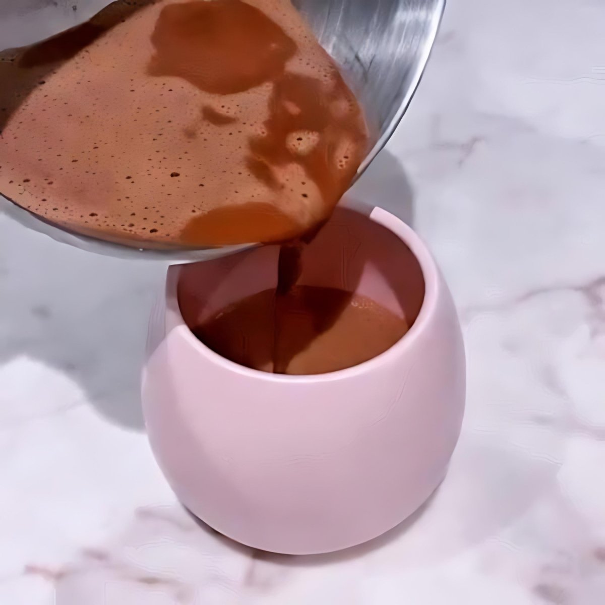 A warm cup of Instant Koko Samoa drinking chocolate by THE KOKO SAMOA, showcasing rich, smooth chocolate in a cozy setting.